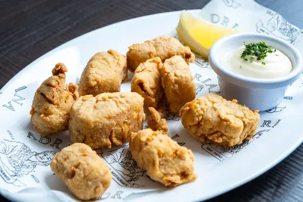 Taquitos de corvina fritos en adobo, pescadería Bar Adriana Sevilla centro